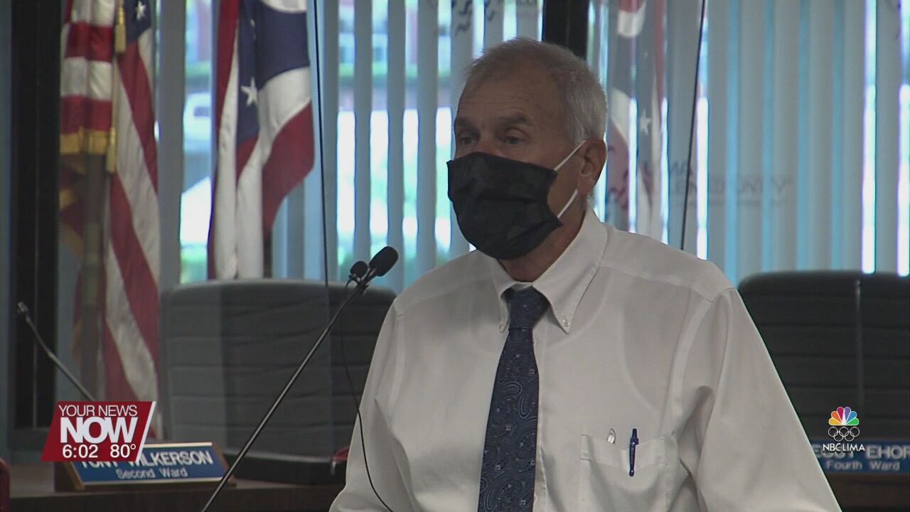 City of Lima following CDC guidelines of masking up to enter buildings